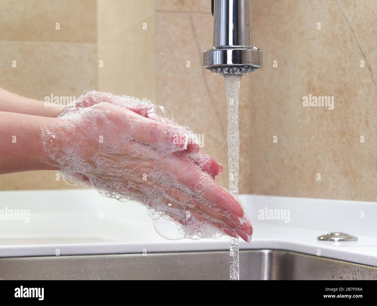 Woman washing hands with antibacterial soap for corona virus prevention ...