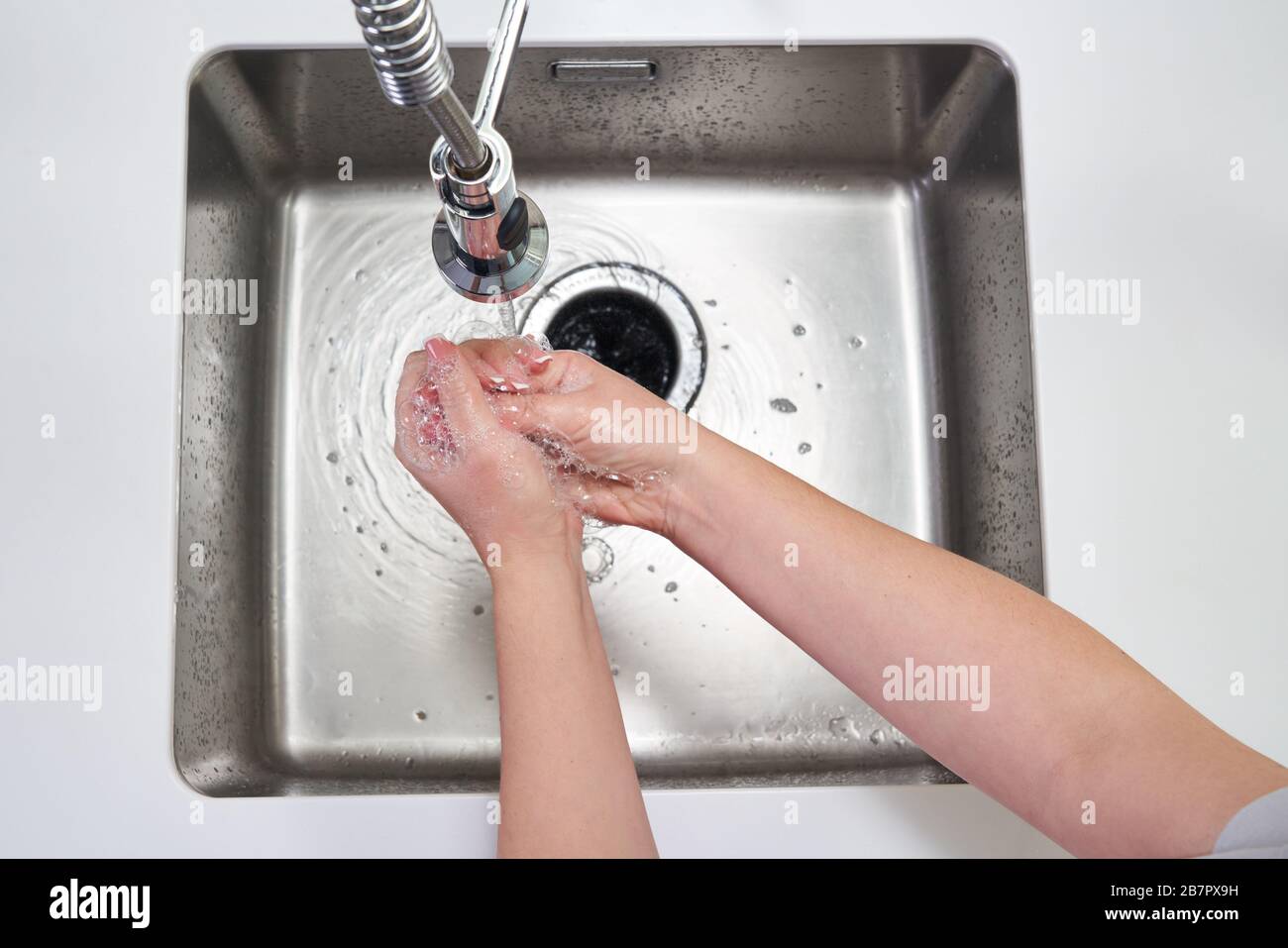 Woman washing hands with antibacterial soap for corona virus prevention ...