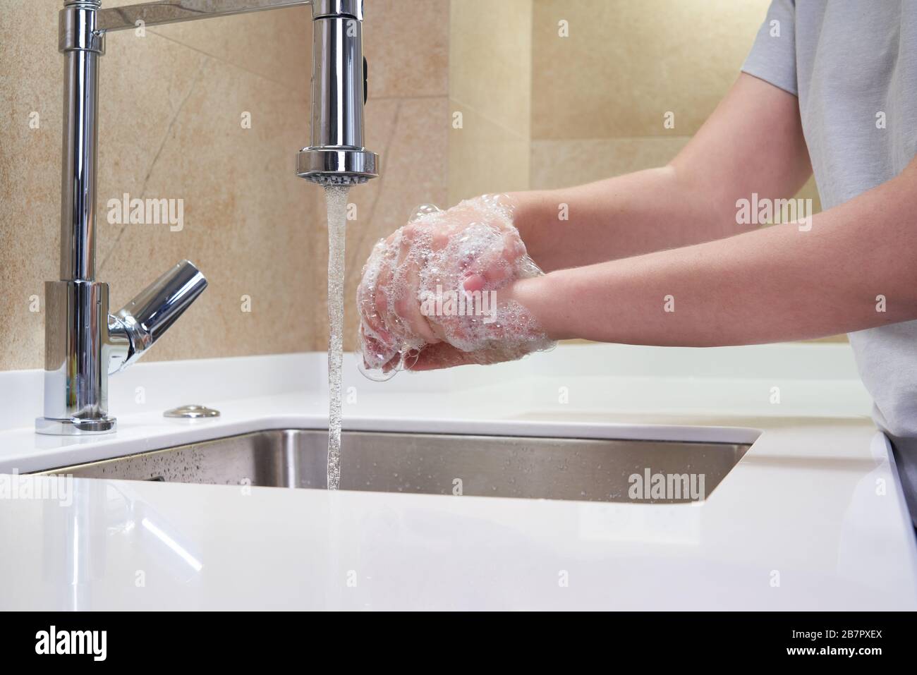Woman washing hands with antibacterial soap for corona virus prevention ...