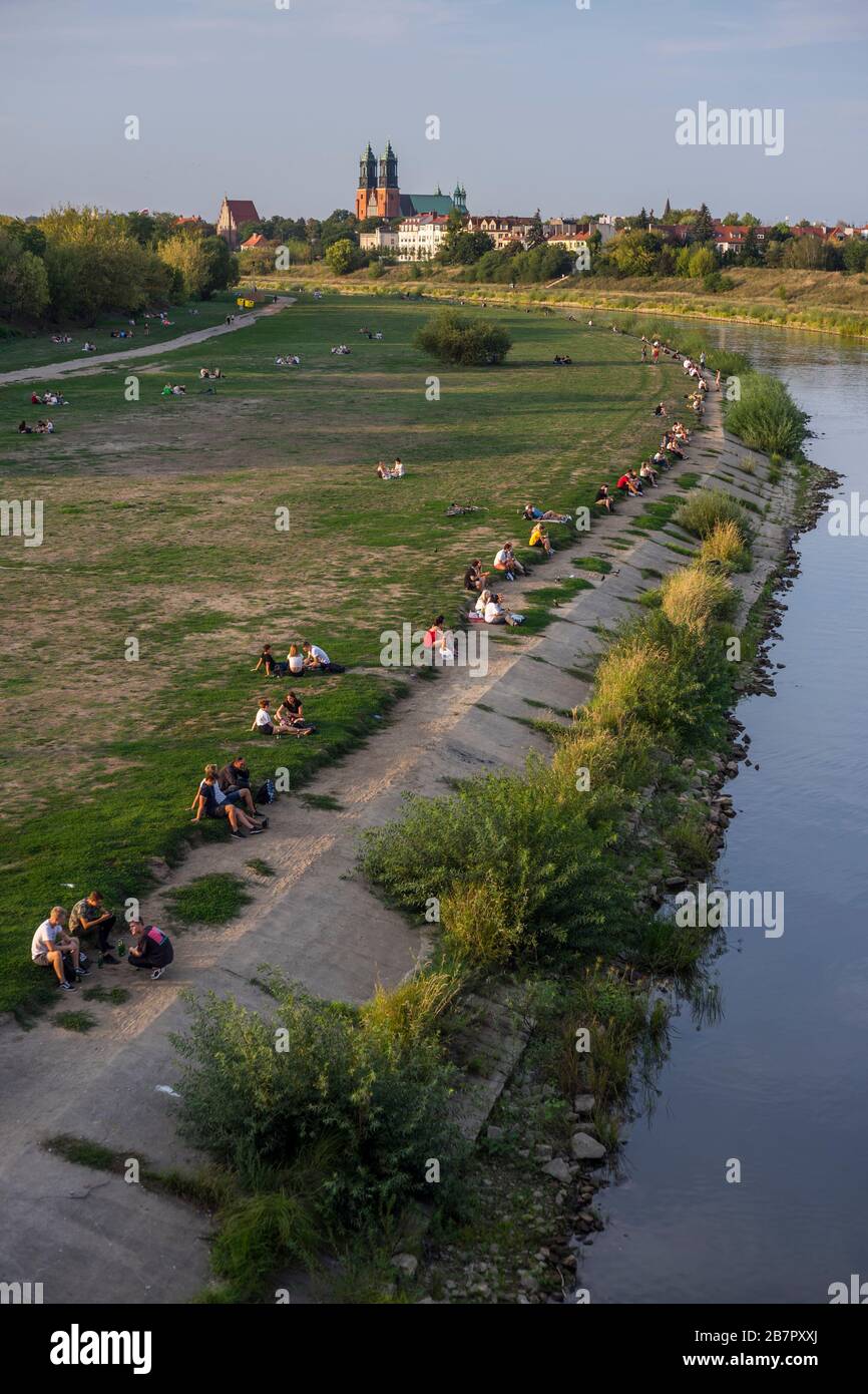 people enjoy the evening on the river bank of the warta river in poznan poland in 2019 stock photo alamy
