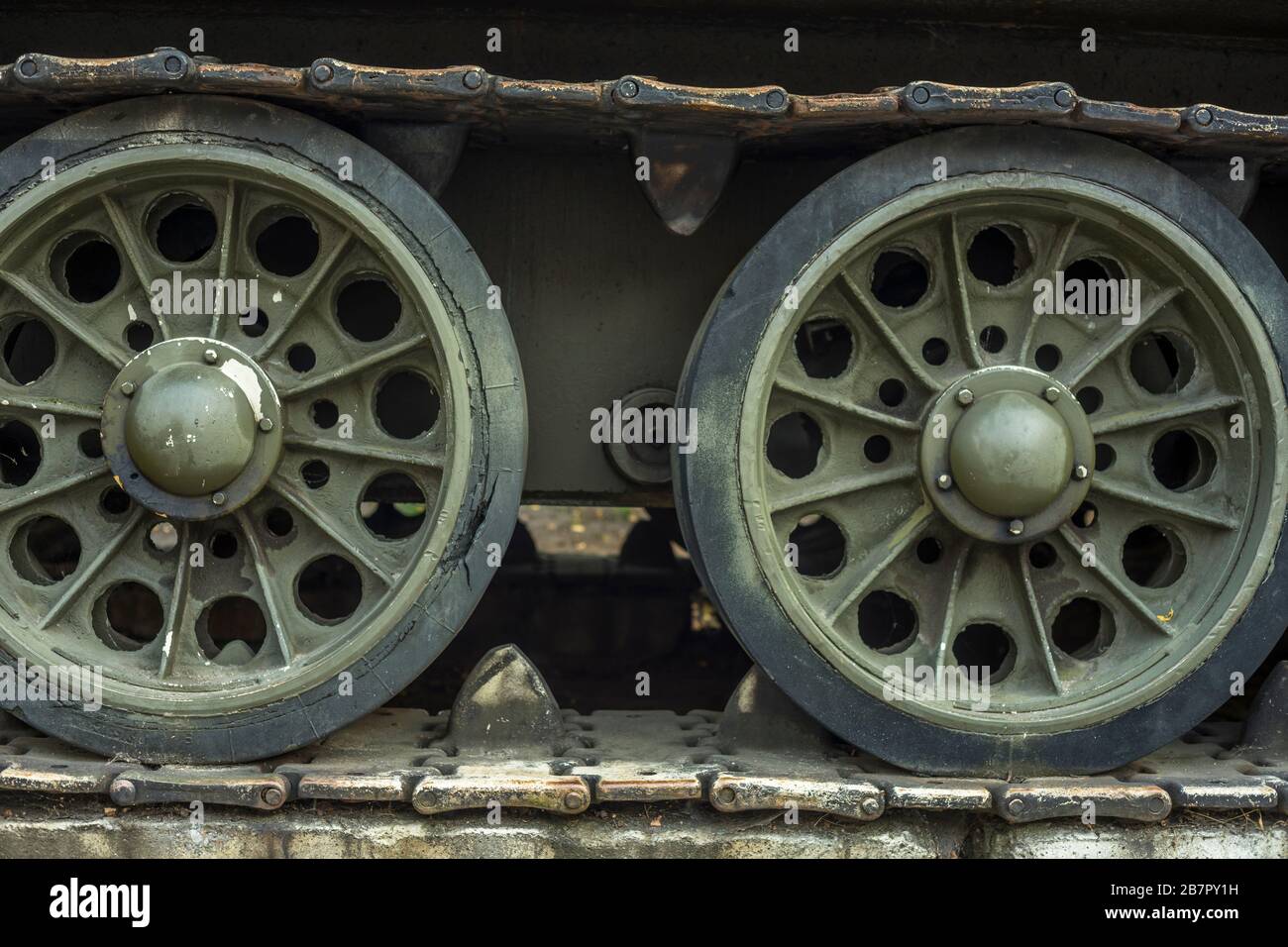 Two wheels and the caterpillar of a T-34 tank, which stands in front of the museum for armament in Poznan, Poland 2019. Stock Photo