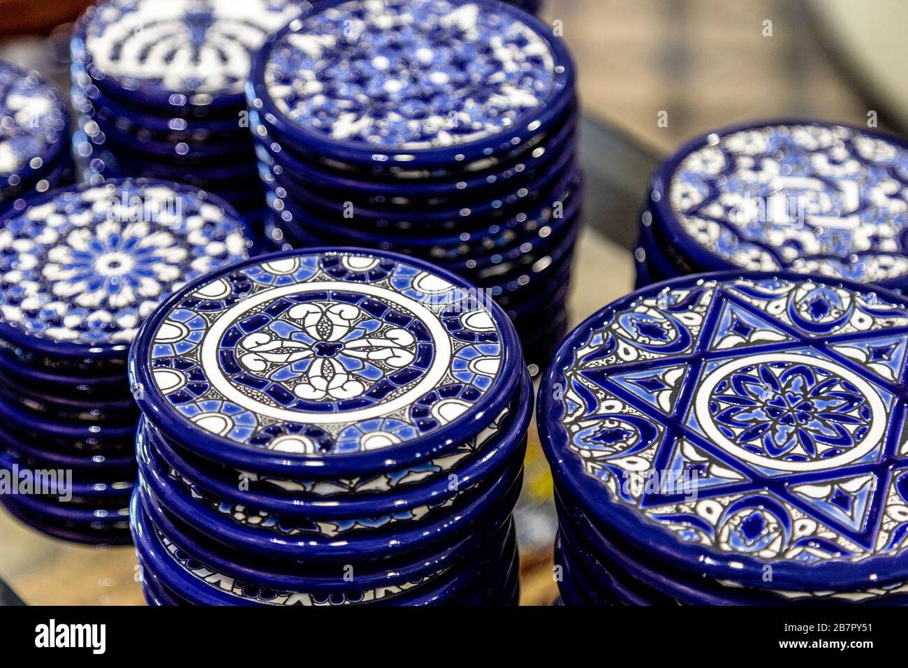 Ornate ceramic coasters at Ceramica Santa Ana in the Triana neighbourhood, Seville, Andalusia, Spain Stock Photo