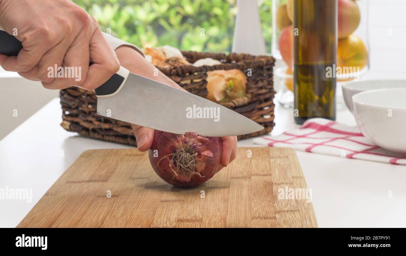 Woman peeling onion table hi-res stock photography and images - Alamy