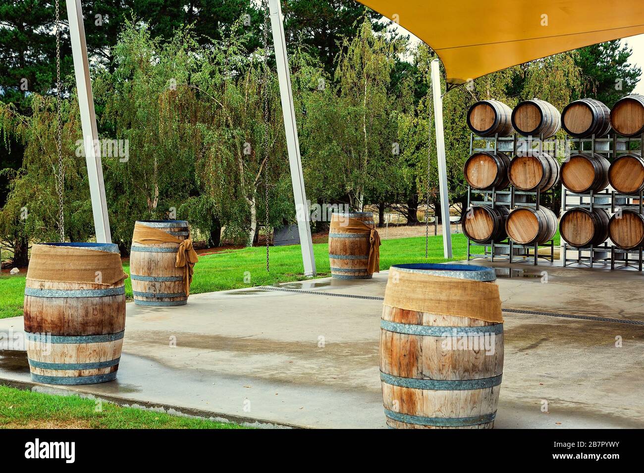 Wine barrels stored on racks and also used as tables for functions