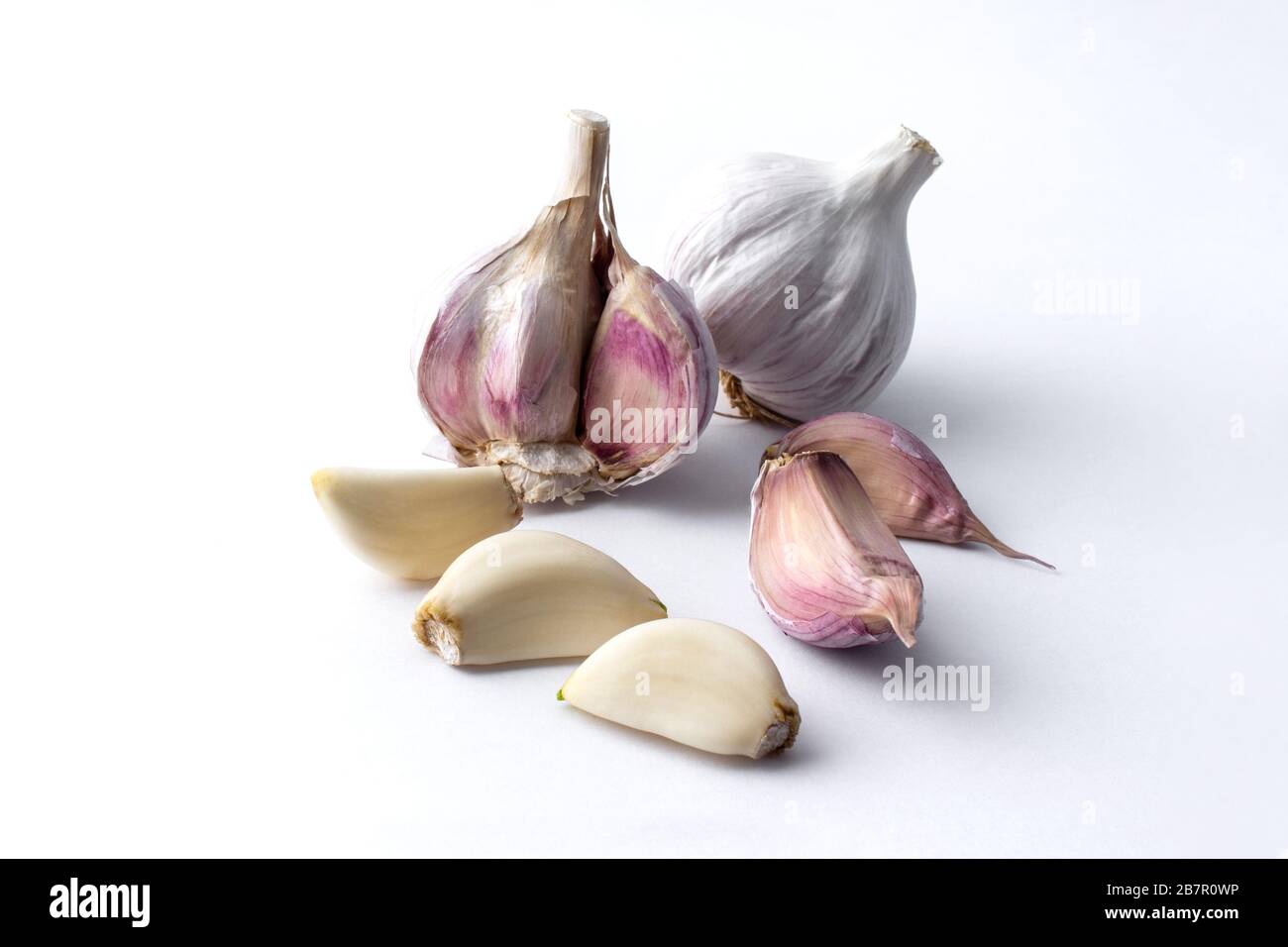 garlic cloves and garlic bulb and white background Stock Photo - Alamy