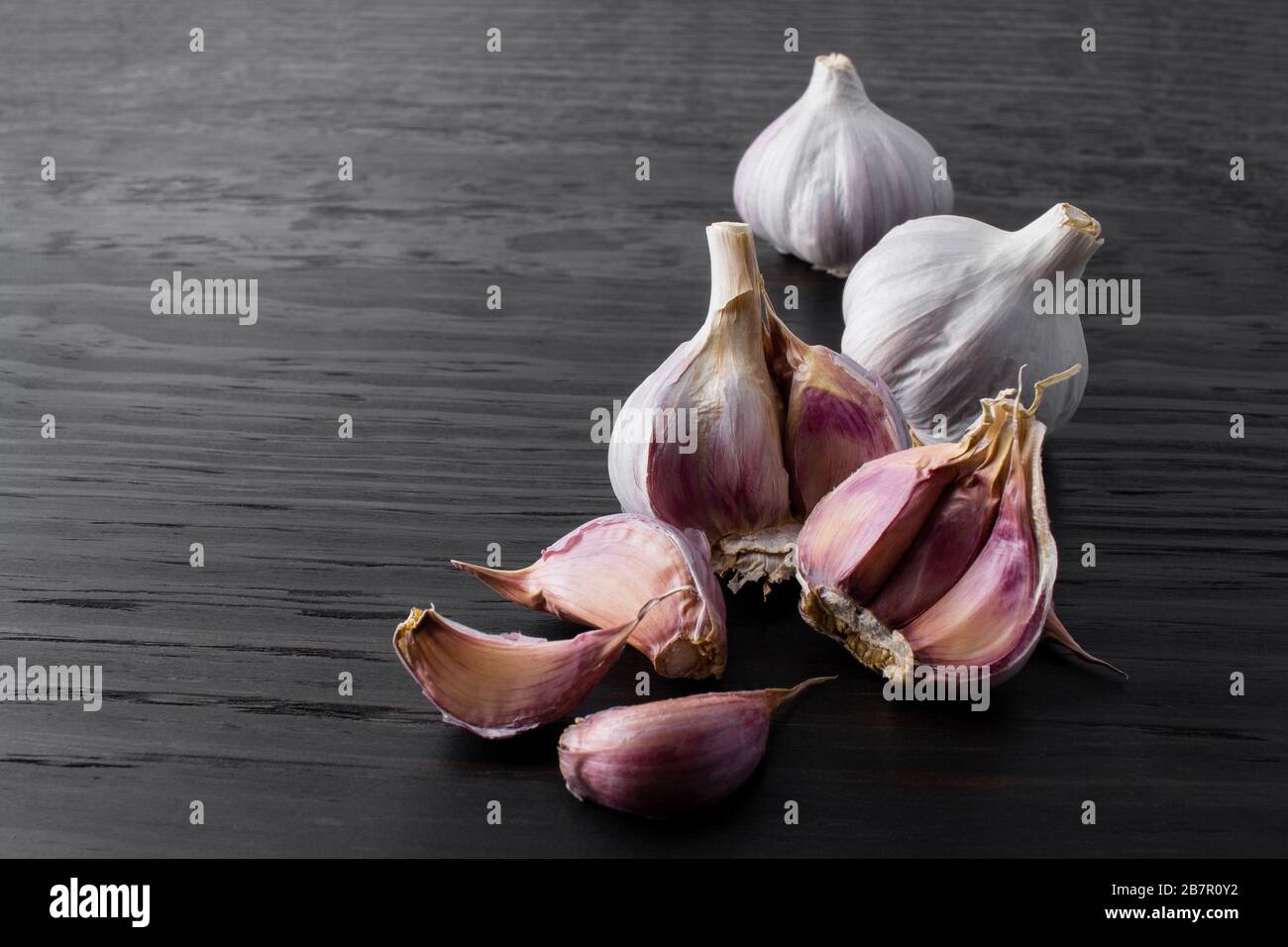 Garlic Cloves And Bulb On Wood Background Stock Photo Alamy garlic-cloves-and-bulb-on-wood-background-stock-photo-alamy