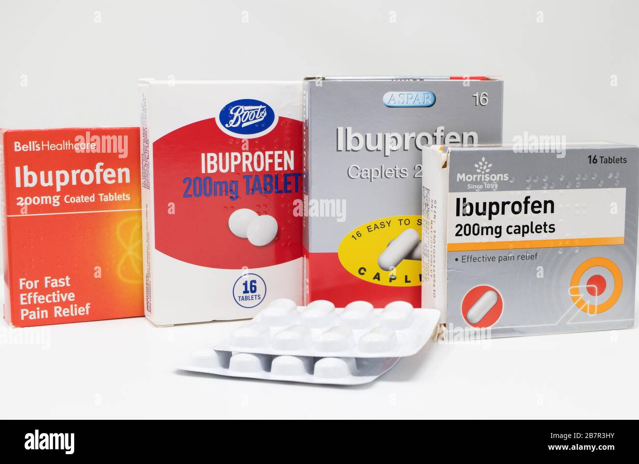 London / UK - March 17th 2020 - Supermarket brands of Ibuprofen anti-inflammatory medication boxes and packs of tablets on a white background. Stock Photo
