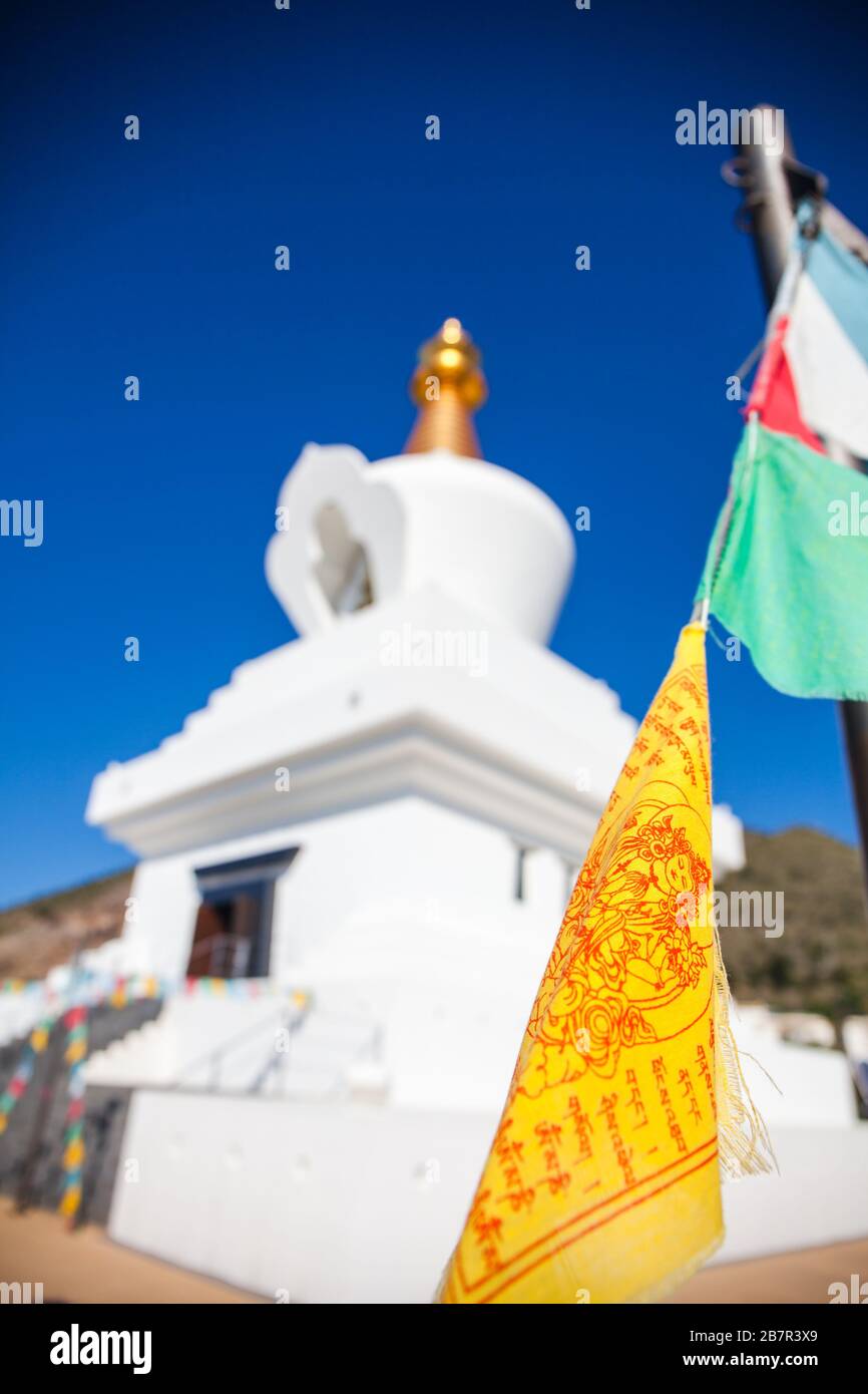 Prayer flag. Colourful buddhist prayer flags at boudhanath stupa in Benalmadena, Andalusia, Spain. Stock Photo