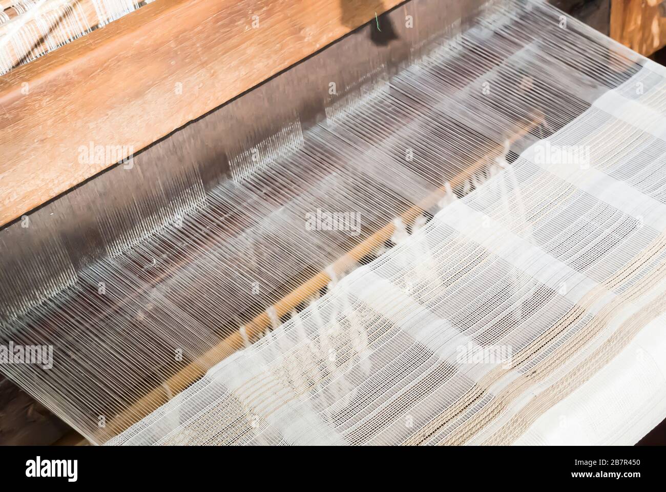 weavingClose-Up of Thread on Loom Stock Photo