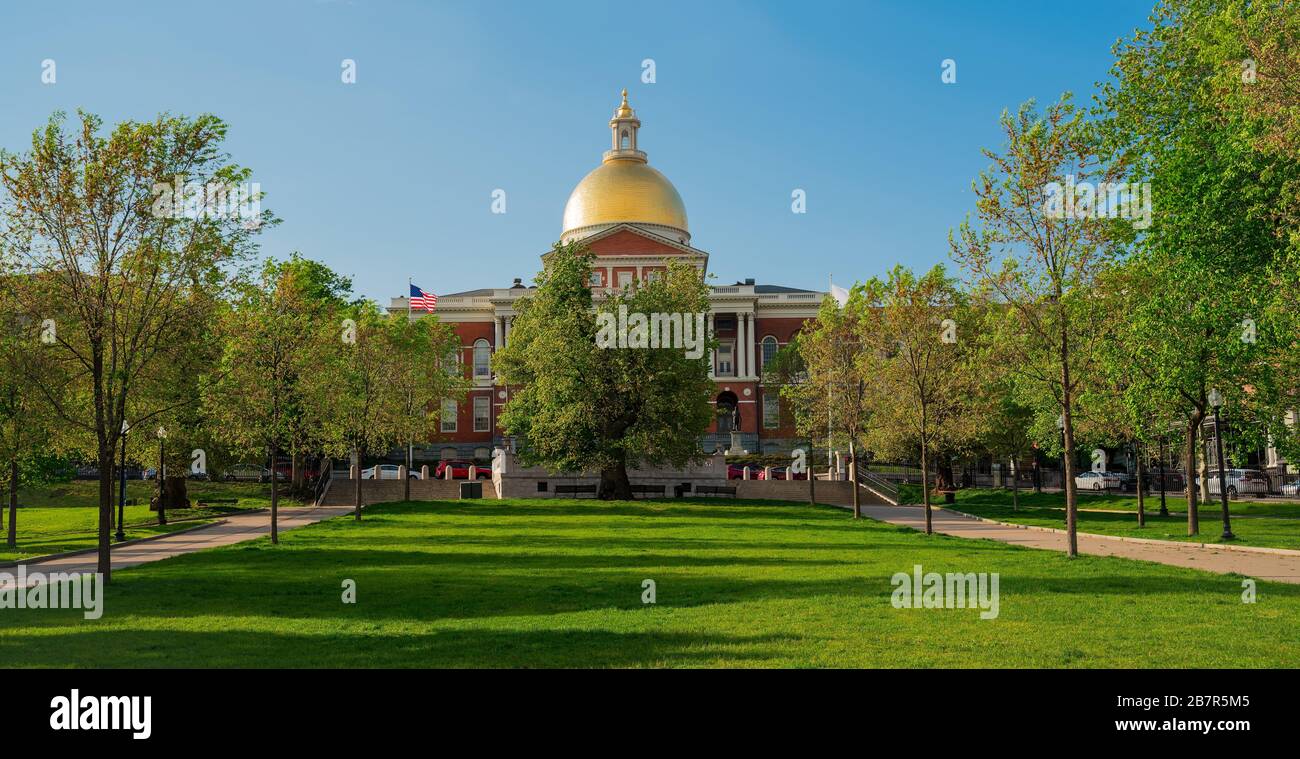 Massachusetts state house with green lawn and blue sky, with nobody. Stock Photo