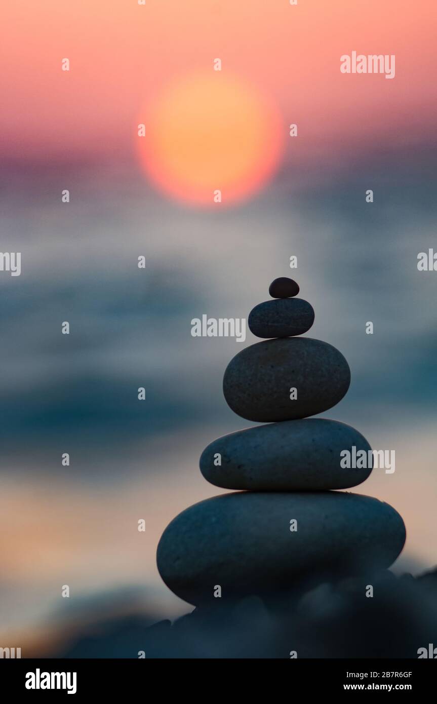 stack of zen stones on pebble beach Stock Photo - Alamy