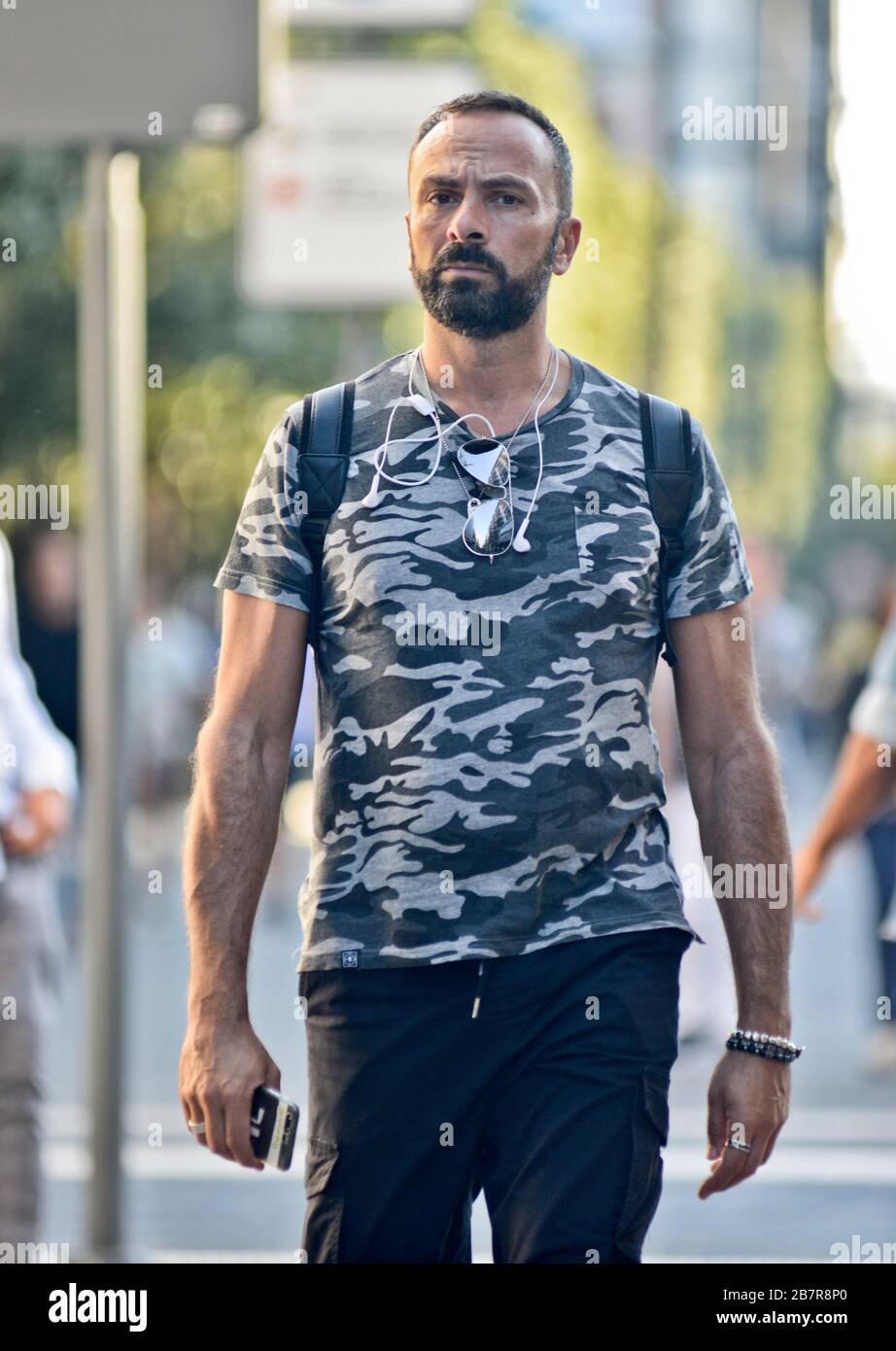 Italian man with a camouflage tshirt walking in Piazza Umberto I, Via Sparano da Bari. Bari, Italy Stock Photo