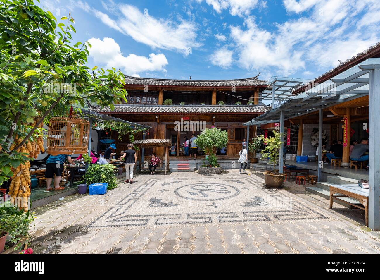 A traditional house of the Naxi people at Lashi Lake where it is a paradise for migrant birds and the origin of the Ancient Tea Horse Road. Stock Photo