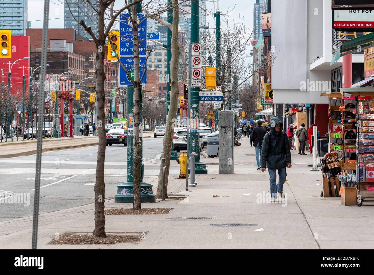 Toronto, Canada. 17th March 2020. A normally busy Spadina Avenue in Toronto's Chinatown is largely empty due to many closures related to COVID-19 preventative measures in Toronto.  Dominic Chan/EXImages Stock Photo