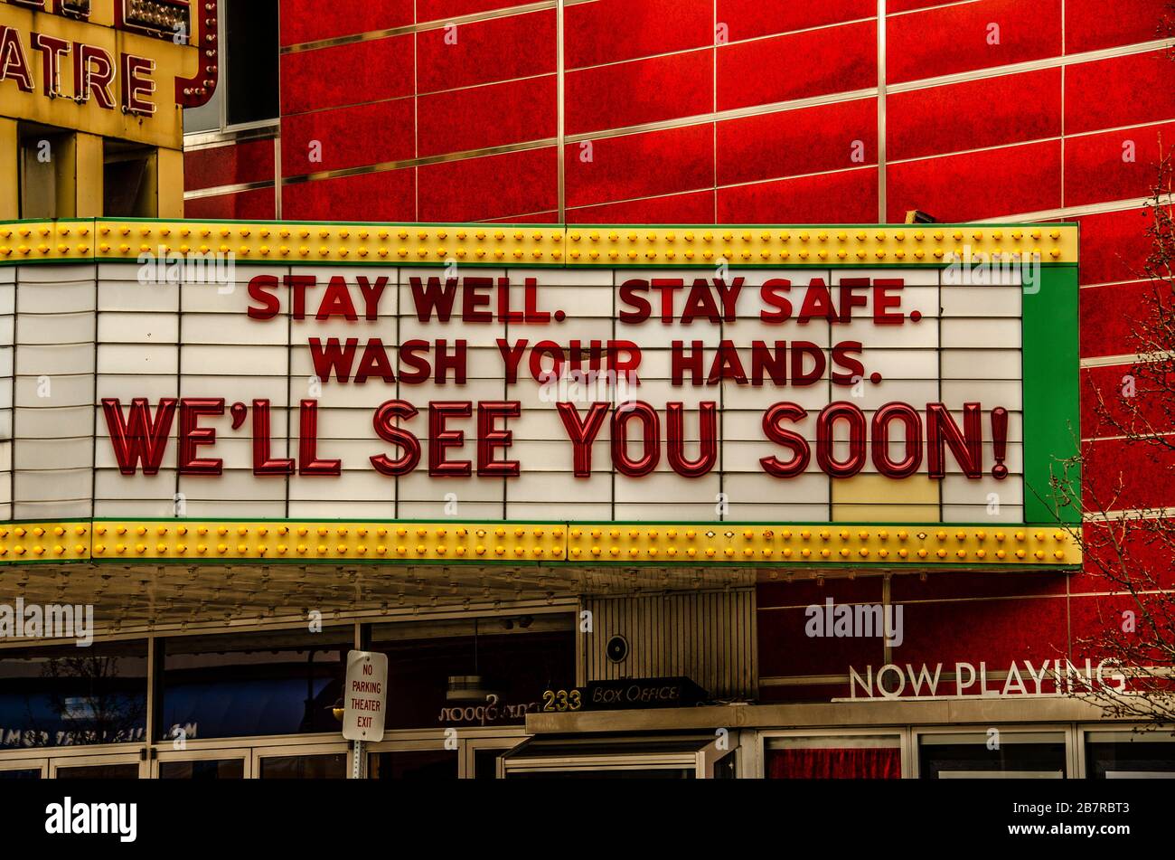Closed movie theatre telling people to stay safe from the coronavirus by washing their hands. Stock Photo