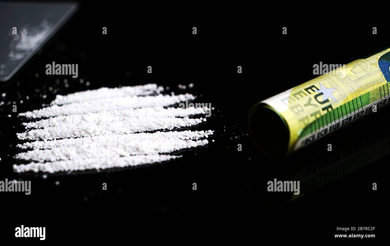 Cocaine lines isolated on black background Stock Photo