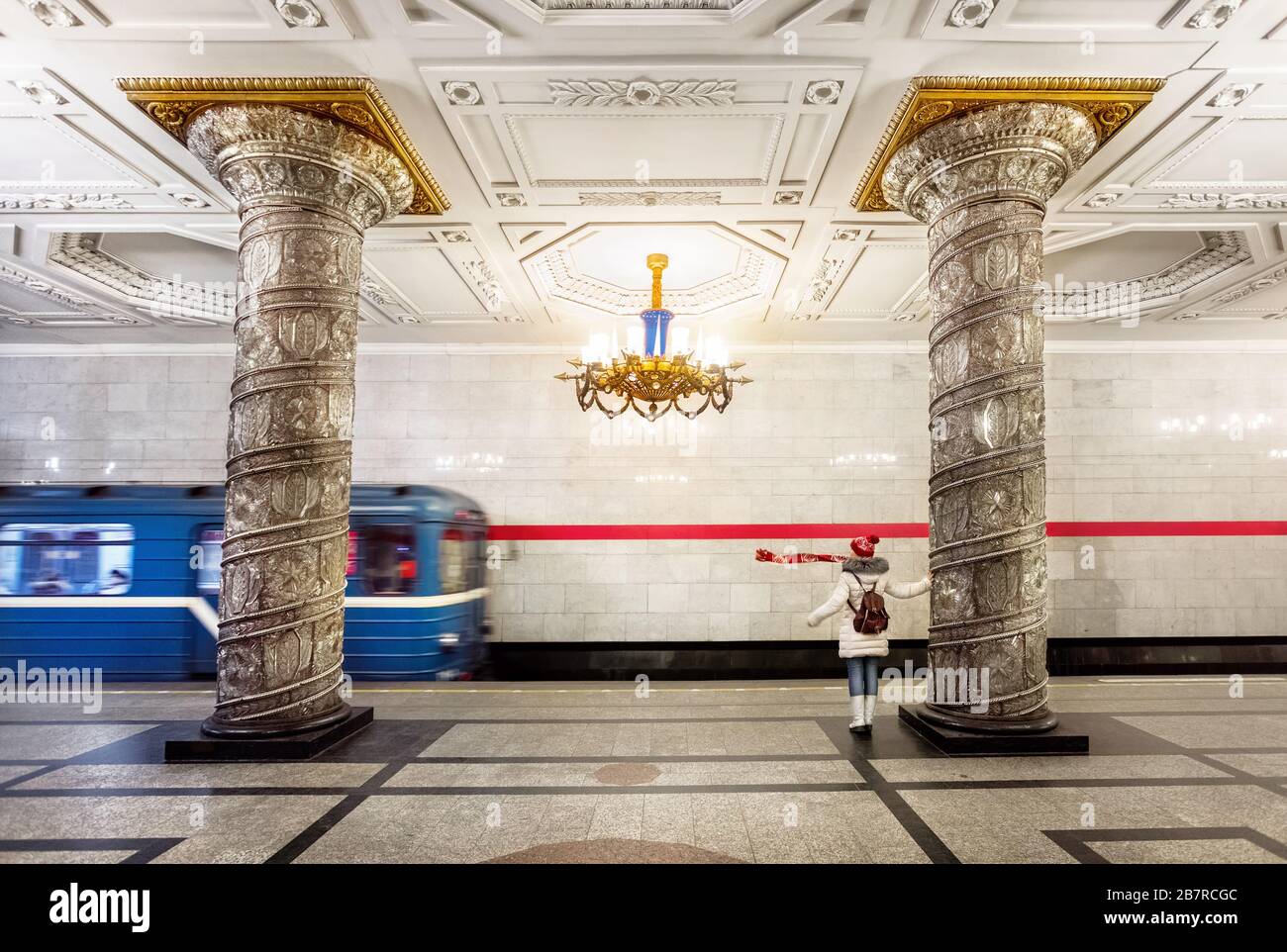 Saint Petersburg, Russia – December 30, 2016. Tourist woman late her train at Avtovo station with Crystal column at the underground metro station in S Stock Photo