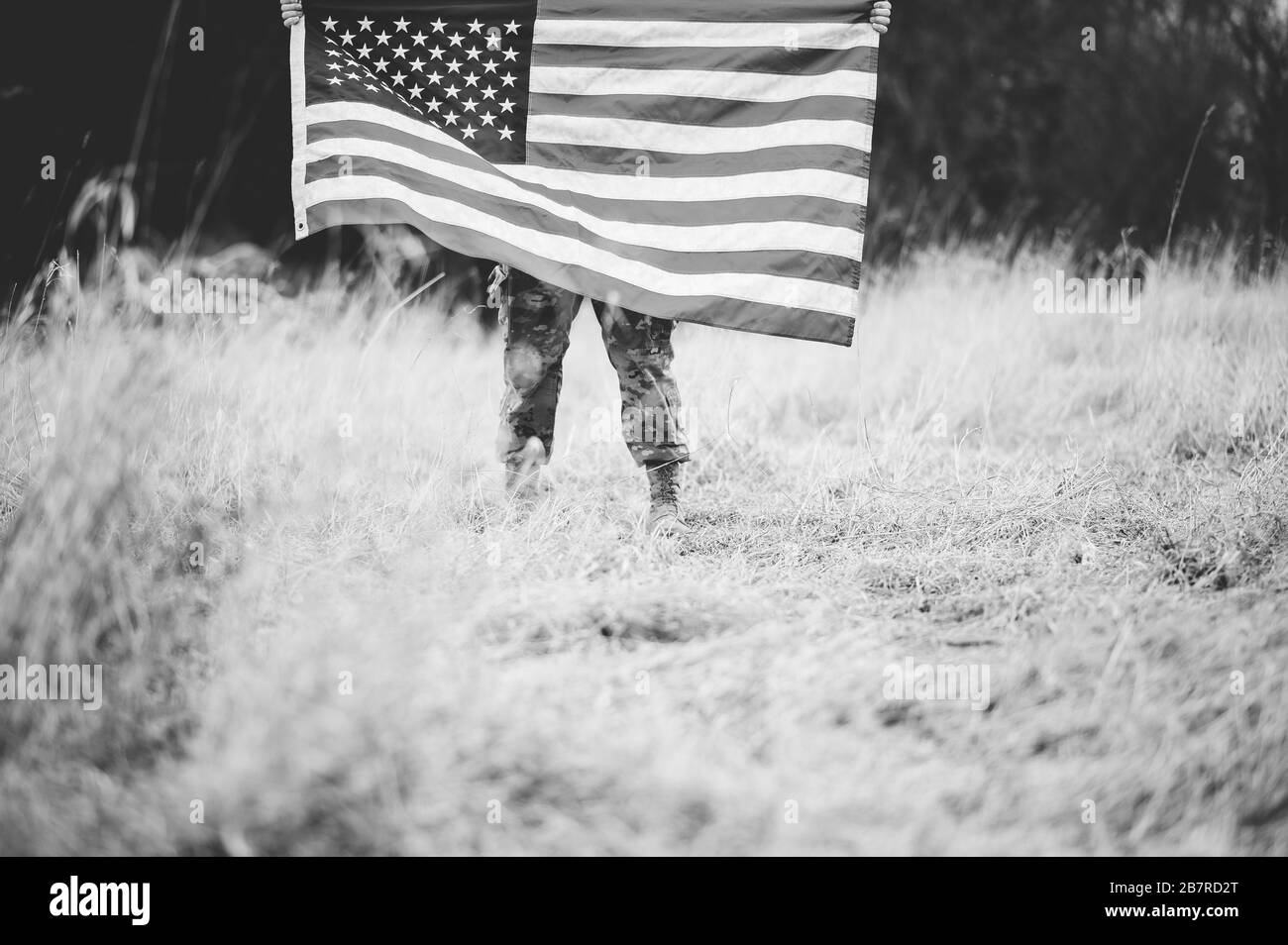 American soldier holding flag Black and White Stock Photos & Images - Alamy