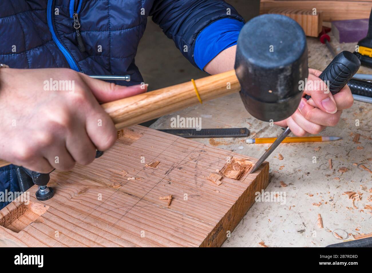 Closeup view of woodwrok with chisel and hammer Stock Photo - Alamy