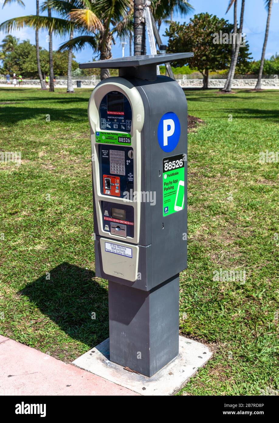 A solar-powered parking meter powered by a solar panel, Miami Beach,  Florida, USA Stock Photo - Alamy