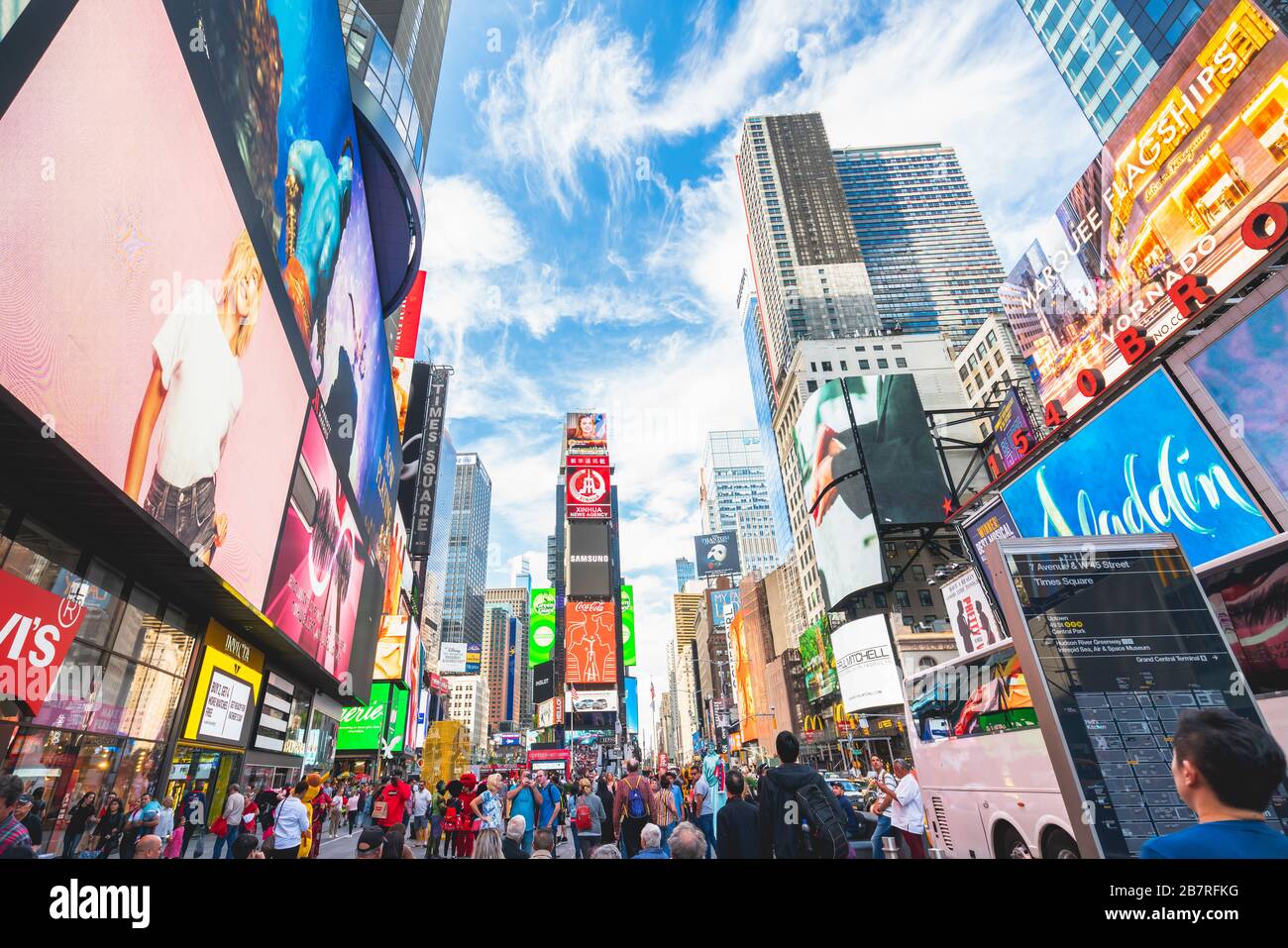 New York City/USA - May 24, 2019  Times Square, one of the world's most visited tourist attractions. Crowded street, brightly lit by billboards and ad Stock Photo