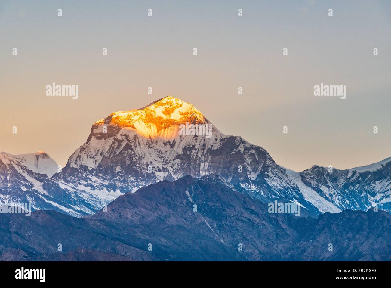 Beautiful sunrise light kissing Dhaulagiri mountain summit viewed from Poonhill Ghorepani Nepal Stock Photo