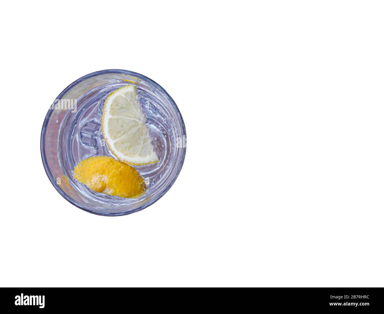 glass of sparkling water with lemon slices isolated on white. drink and refreshment concept Stock Photo