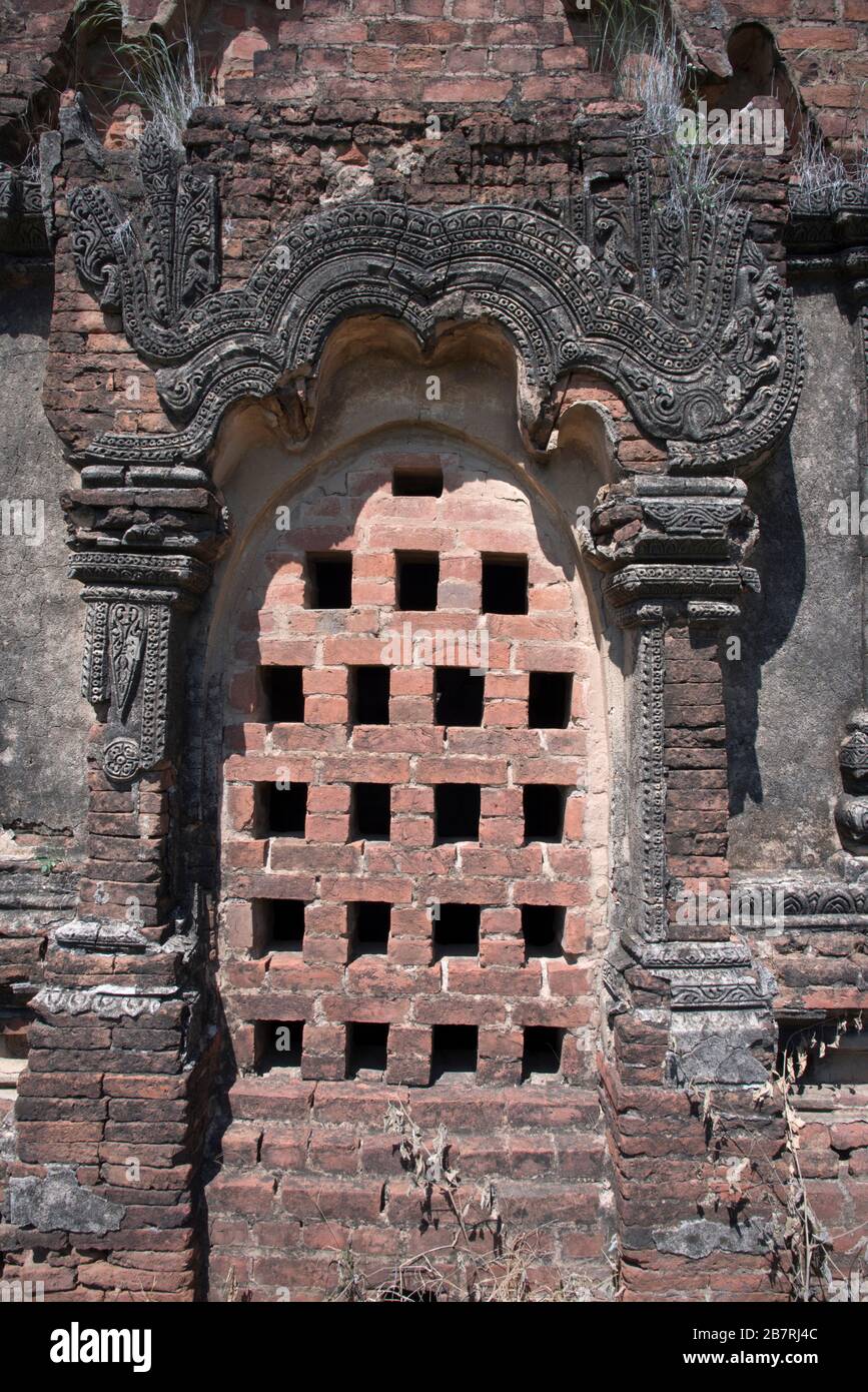 Myanmar: Bagan- Salay. General View of a perforated window to light the interior of one of the three temples of Paya Thon Zu. Stock Photo