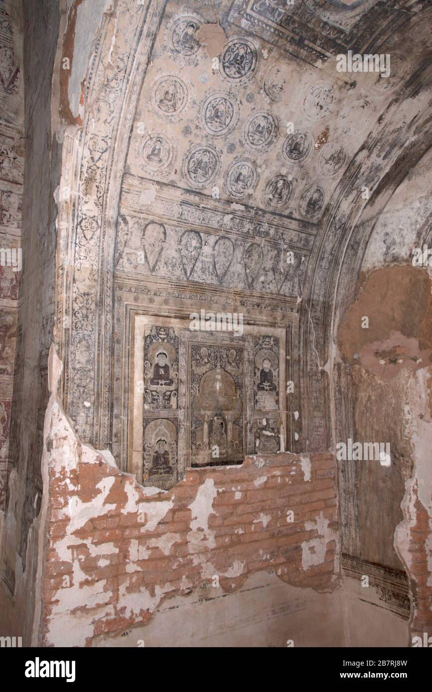 Myanmar: Bagan- Phya temple-painted Buddha images on the left of the nitche. Stock Photo