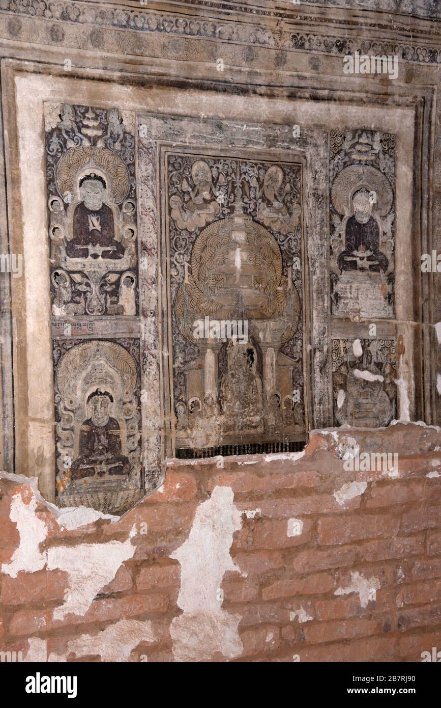 Myanmar: Bagan- Phya temple-painted Buddha images on the right of the nitche. Stock Photo