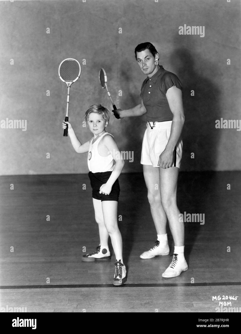 Child Star JACKIE COOPER and Tarzan actor JOHNNY WEISSMULLER 1932 Publicity  Pose with Badminton Racquets Metro Goldwyn Mayer Stock Photo - Alamy