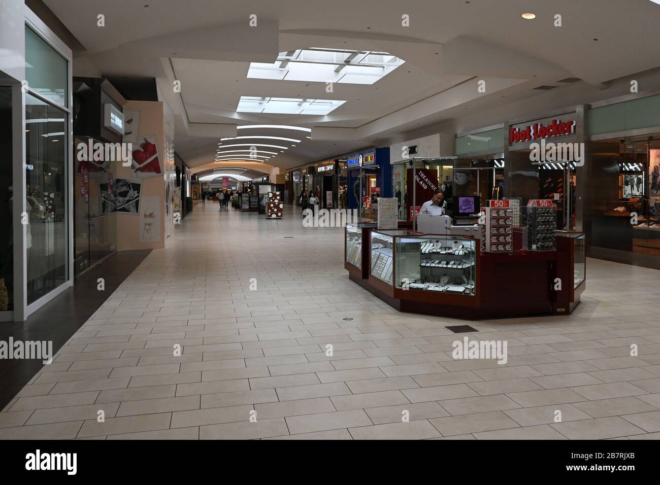 Cerritos, United States. 17th Mar, 2020. General overall view of the deserted Los Cerritos Center mall, Tuesday, March 17, 2020, in Cerritos, Calif. The shopping center has reduced hours and stores have closed because of the coronavirus COVID-19 pandemic outbreak. Photo via Credit: Newscom/Alamy Live News Stock Photo
