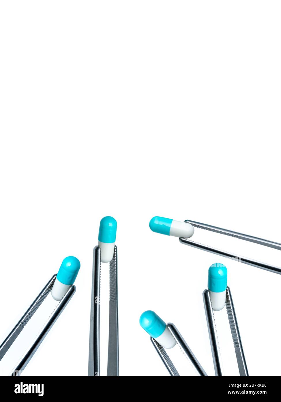 5 forceps pick whiteblue capsule isolated on white background. Drugs choose. Drug selection in