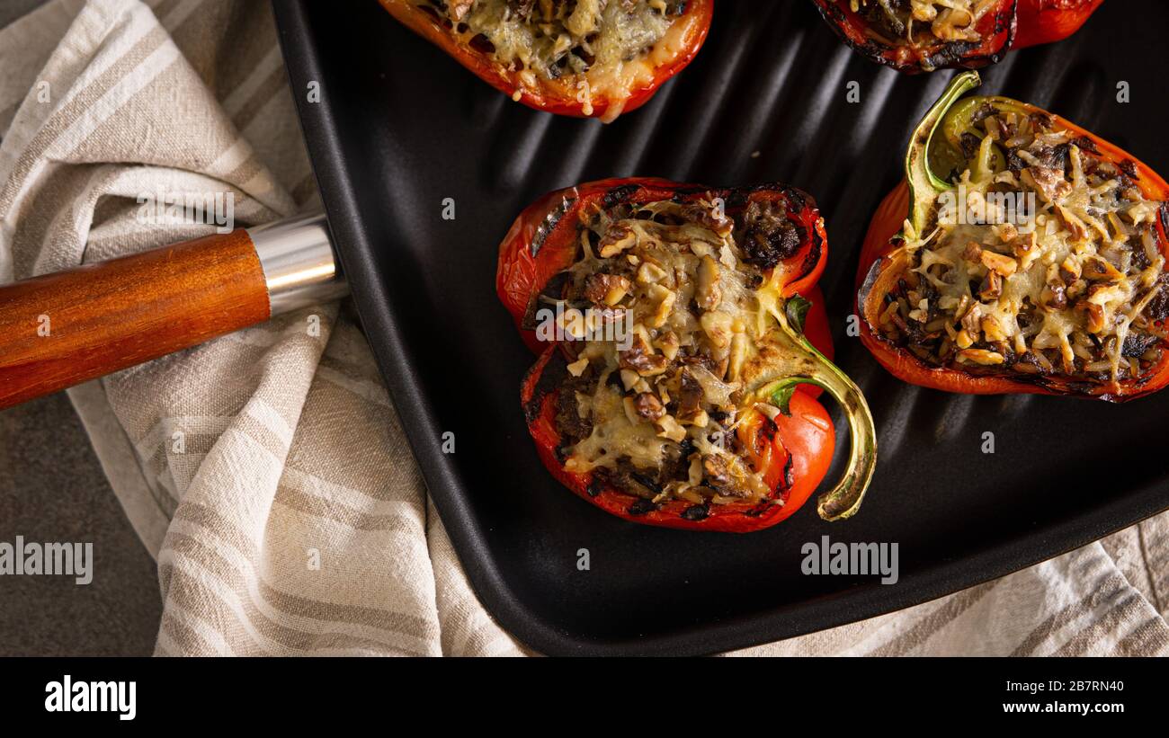 Oven baked red stuffed paprika. Dinner, lunch, vegetarian, healthy.  Stock Photo