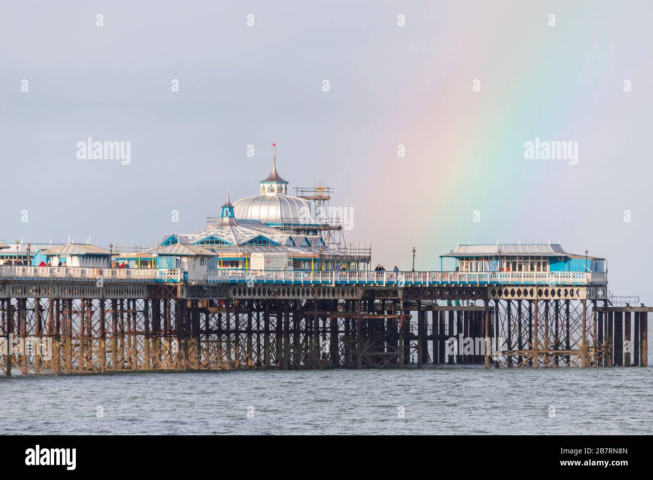 Rainbow over Llandudno Pier on the North Wales coast Stock Photo