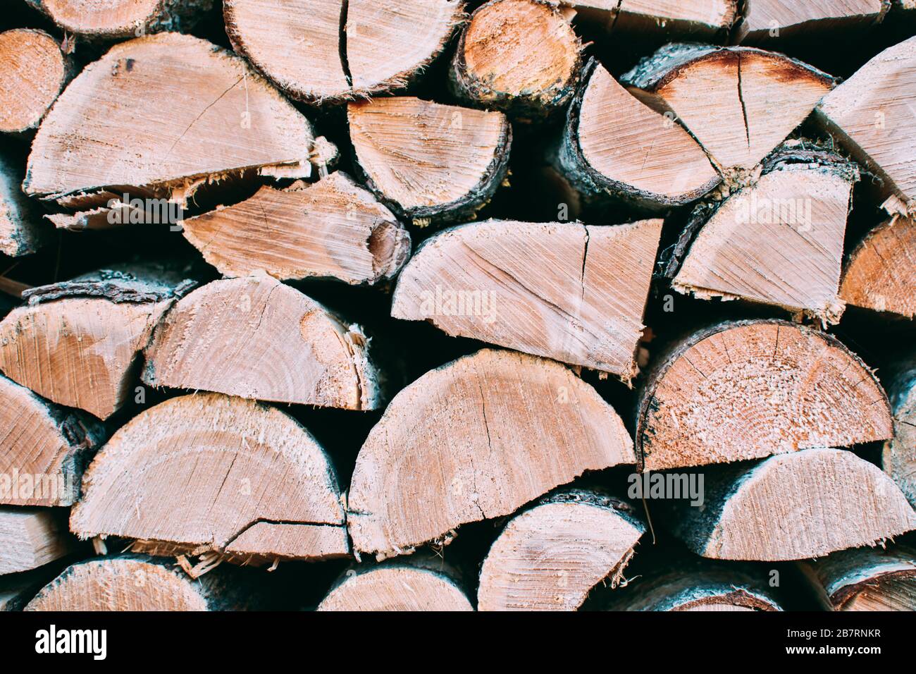 Surface of chopped fire wood, folded exactly crushed firewood. Close up. Wood background. Stock Photo
