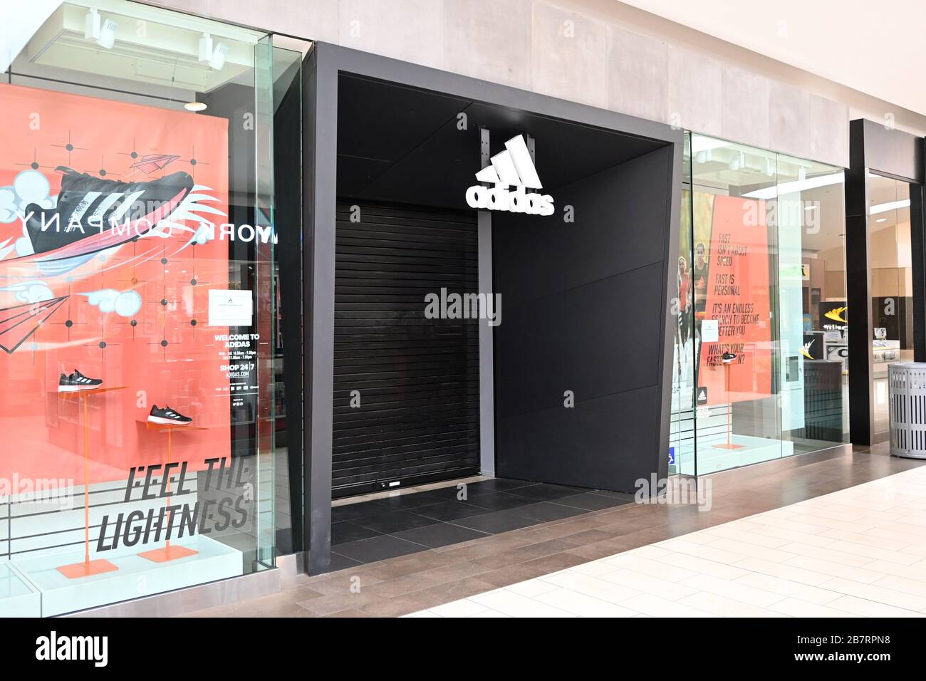General overall view of the closed Adidas store at the Los Cerritos Center  mall, Tuesday, March 17, 2020, in Cerritos, Calif. The shopping center has  reduced hours and stores have closed because