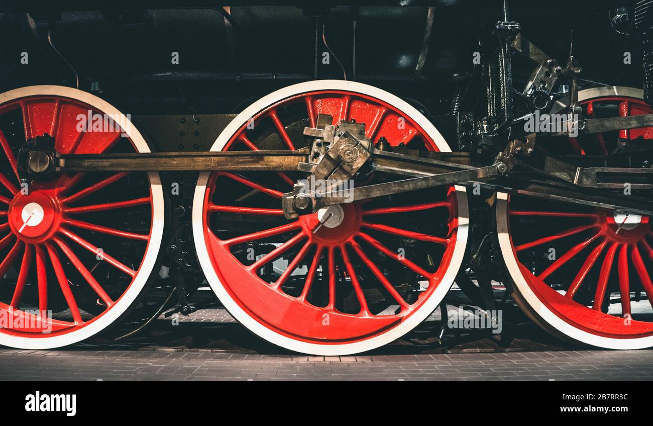 Red wheels of old retro steam train at railway museum Stock Photo
