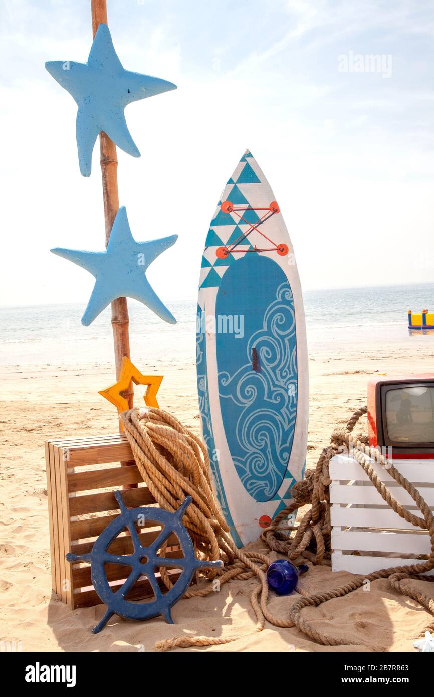 Photo booth setup on beach. Summer, surfing and fishing theme for an event  party or birthday Stock Photo - Alamy