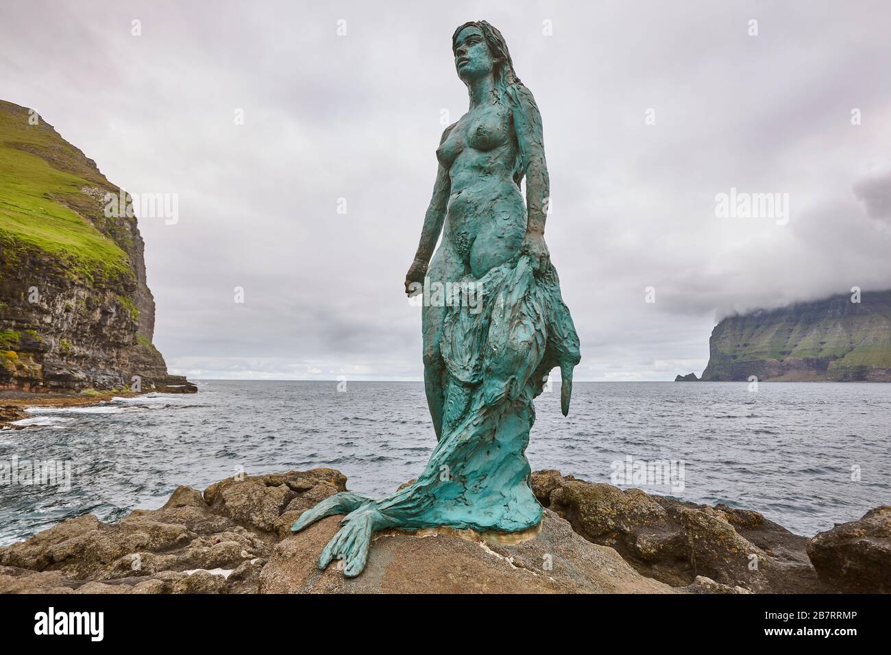 Faroe islands fjord coastline landscape in Kalsoy island. Mikladalur mermaid Stock Photo