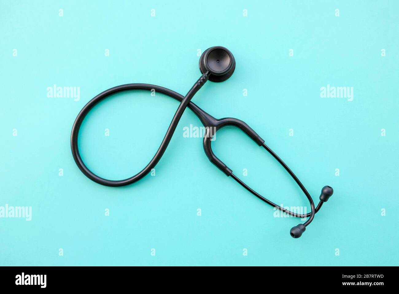 Black modern stethoscope on light blue background, top view Stock Photo -  Alamy