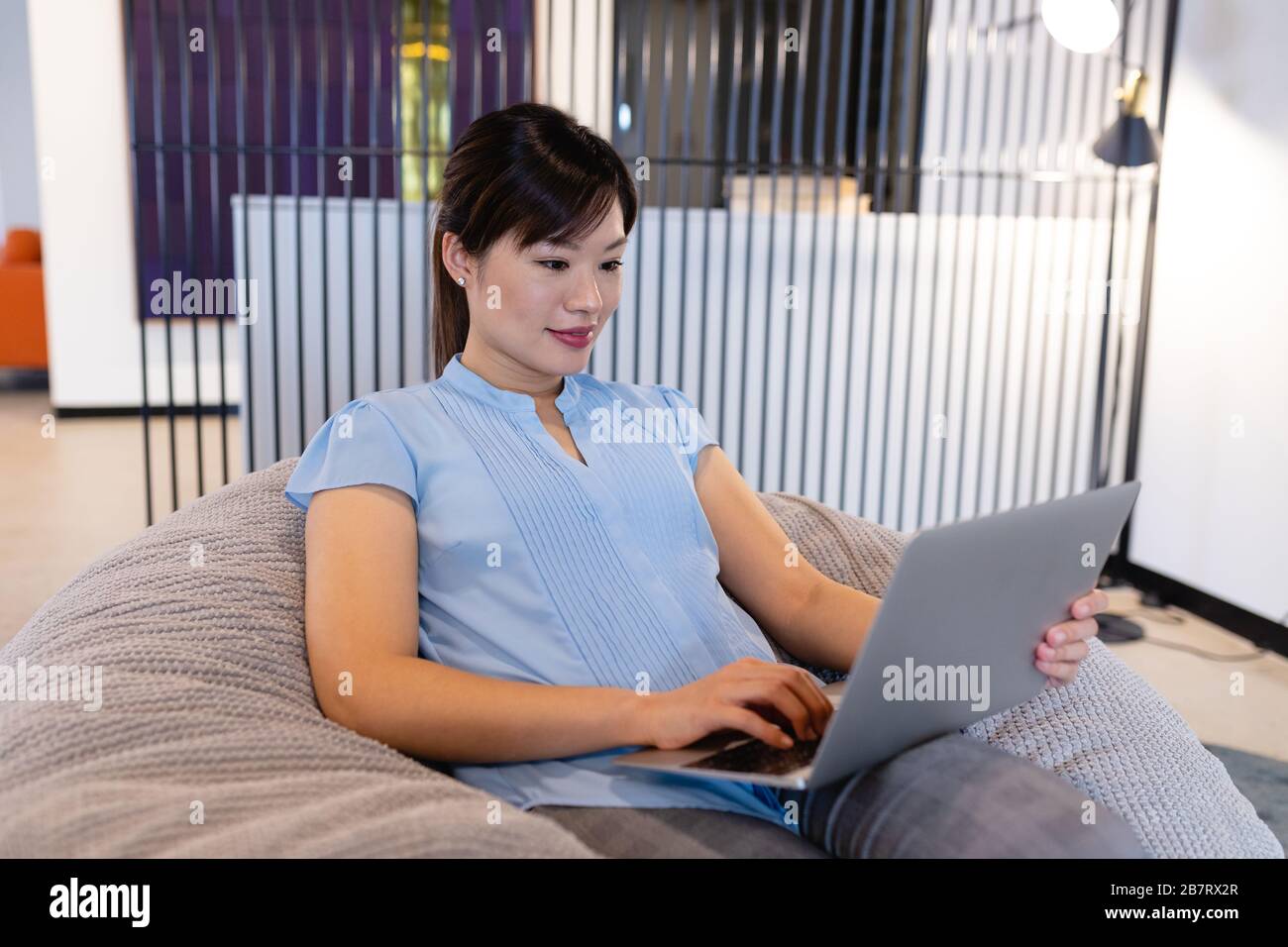 Woman sitting on bean bag hi-res stock photography and images - Alamy