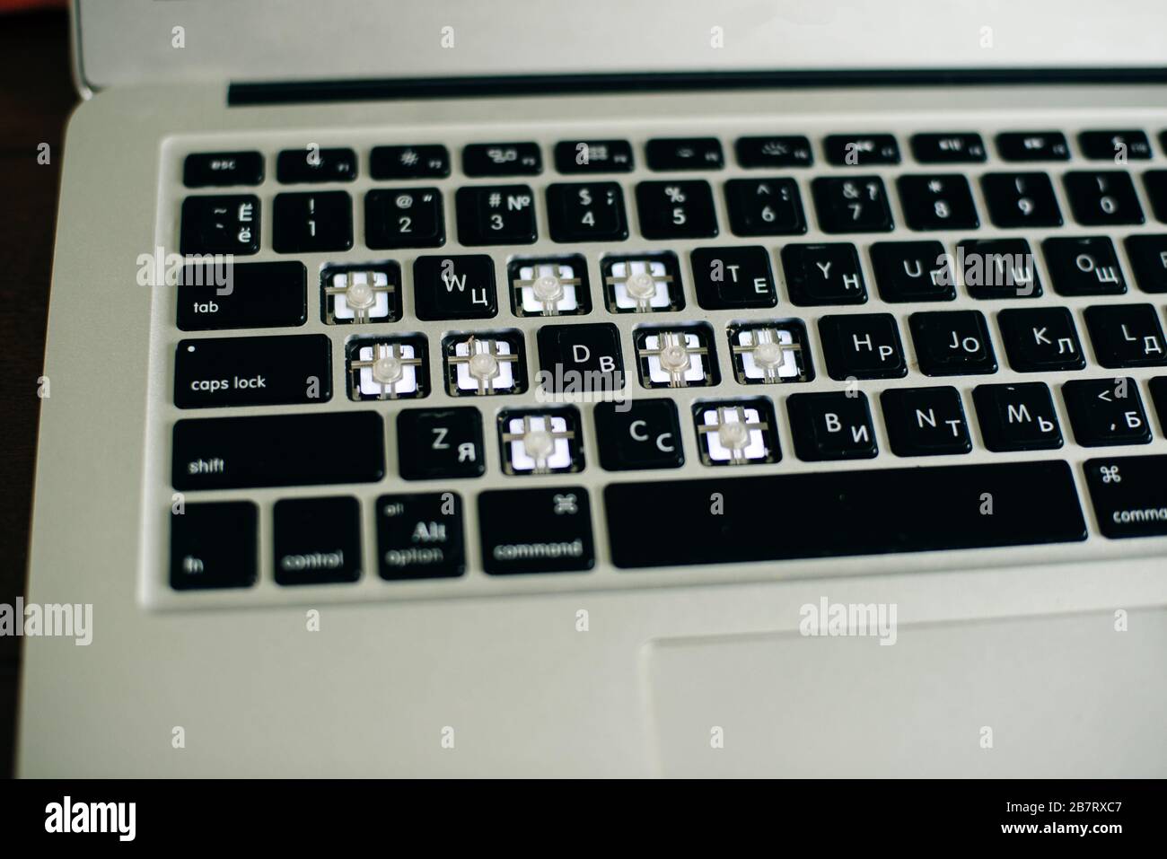 screwdriver and spare parts from a laptop. Keyboard, brush, keys