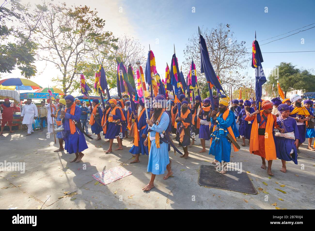 Nihang Singhs march from one Gurudwara to another celebrating the festival of Hola Mohalla in Anandpur Sahib, Punjab, India Stock Photo