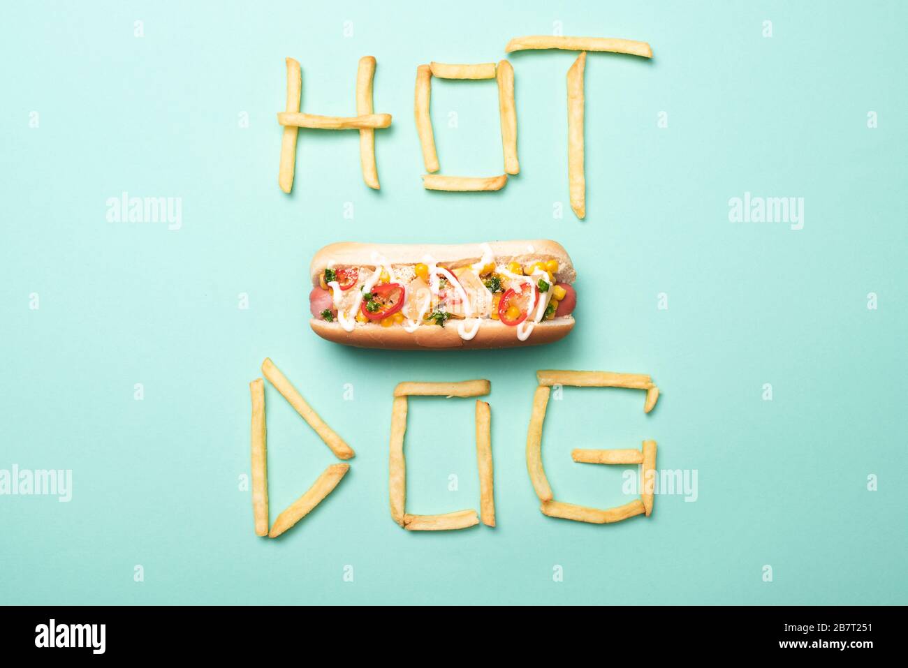 top view of american hot dog on blue with word hot dog made from french fries Stock Photo Alamy