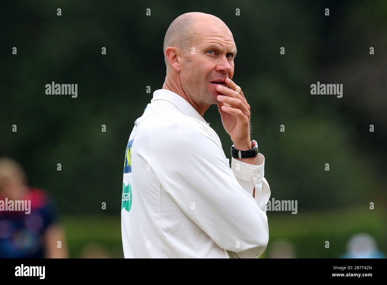 Umpire Mike Burns looks on as rain delays the start of play on Day Two Stock Photo