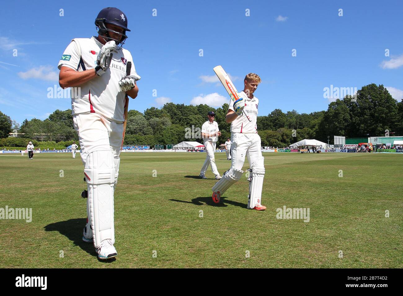 Sam Billings of Kent (R) leaves the field having scored a century in a Kent total of 633 for 8 declared Stock Photo