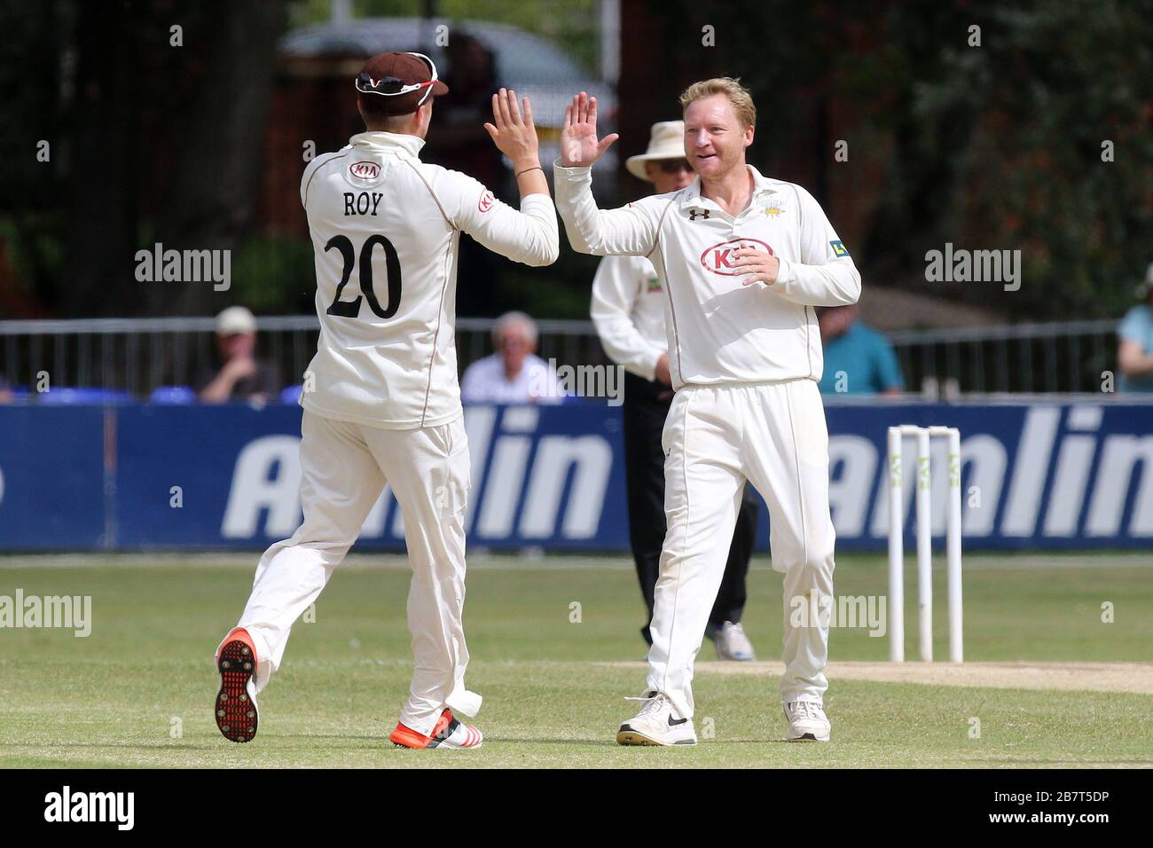Gareth Batty of Surrey CCC (R) claims the wicket of Tom Westley Stock Photo