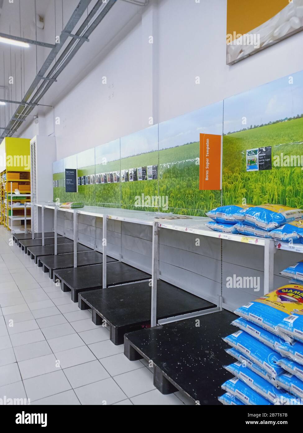 Empty Shelves In The Rice Section Inside Tesco Supermarket In Tanjung Tokong Penang Malaysia On March 18 2020 People Flocked To Supermarkets To Stockpile On Food And Other Daily Necessities After Malaysia