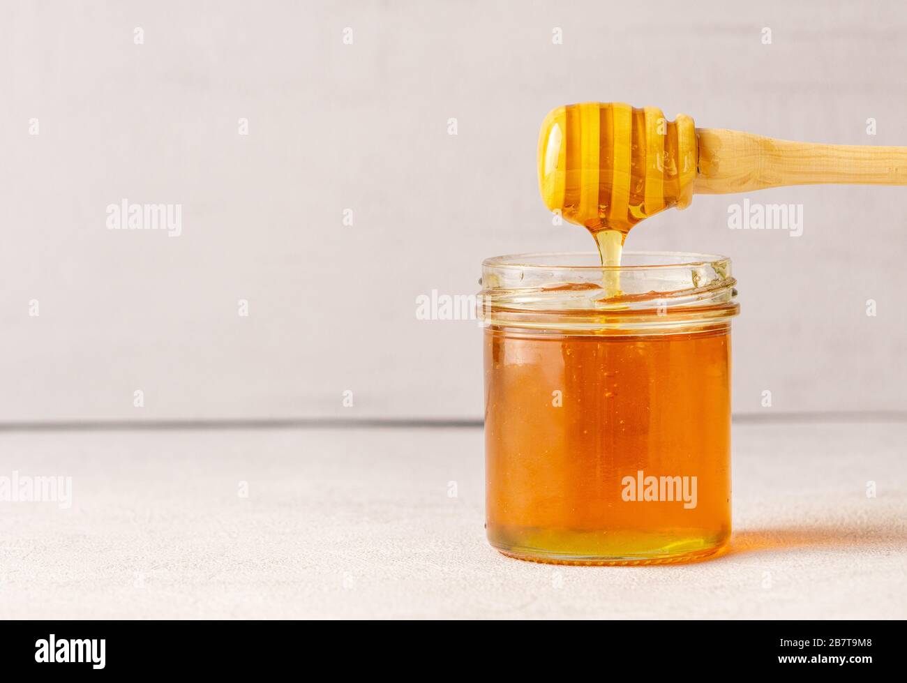 Honey jar, pot, honey spoon. Health. immunity. Isolated. Copy space.  Stock Photo